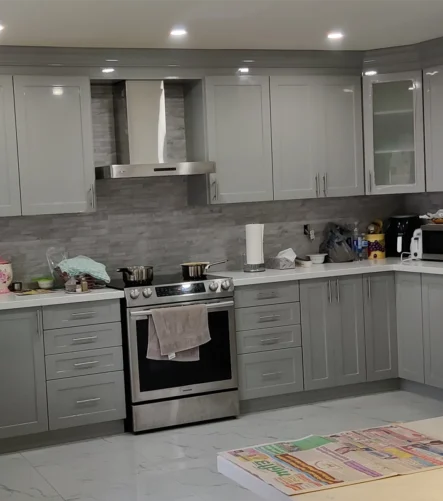 A grey and white kitchen renovation project completed by Titan Cabinetry