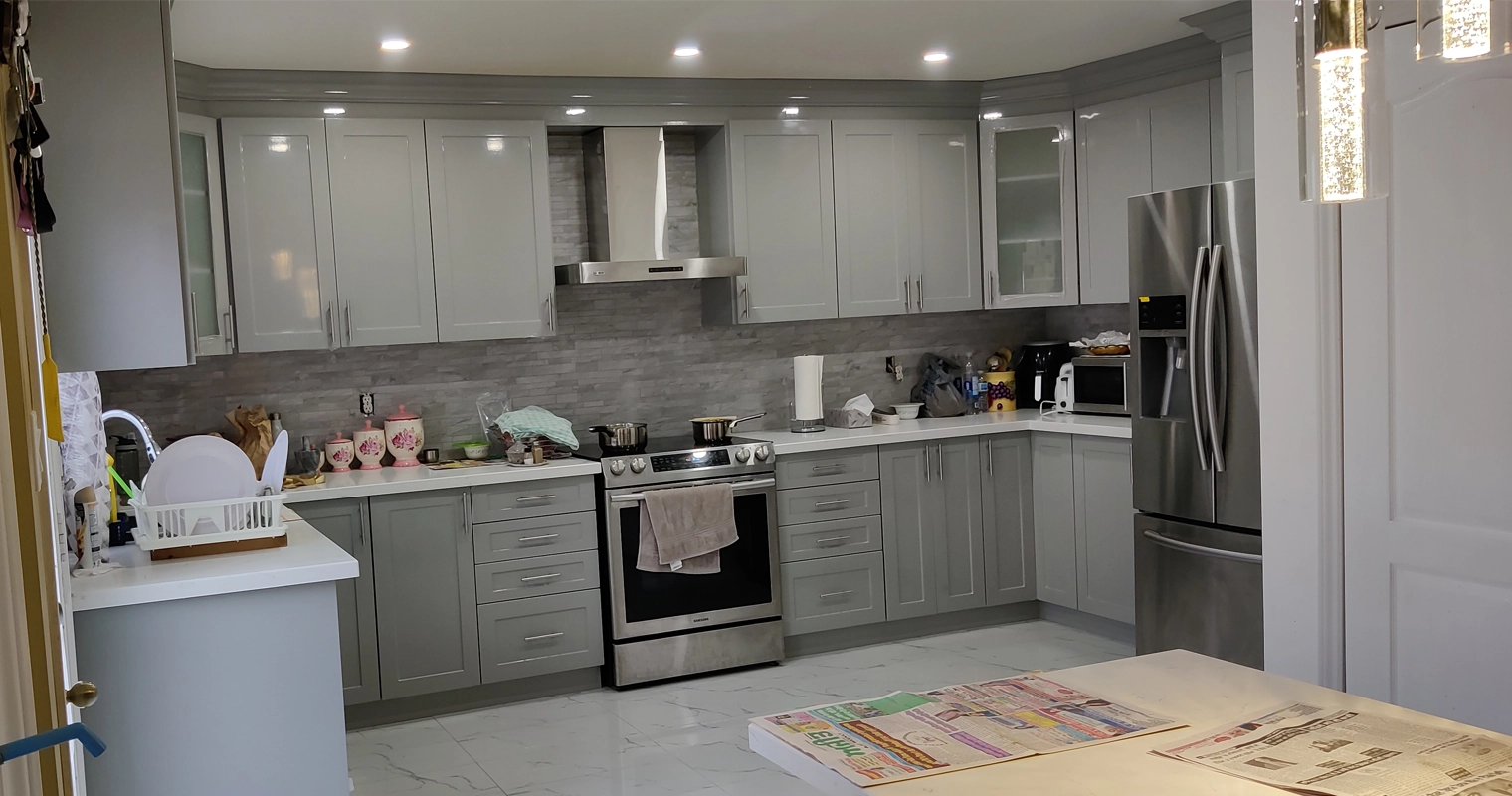 A grey and white kitchen renovation project completed by Titan Cabinetry