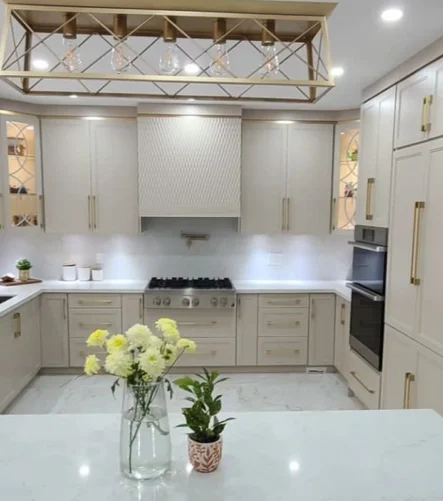 A beige and gold custom kitchen installation completed by Titan Cabinetry