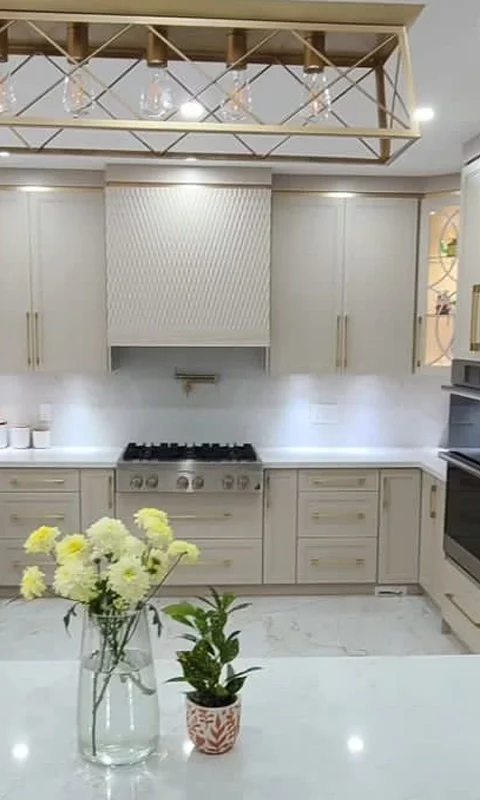 A beige and gold custom kitchen installation completed by Titan Cabinetry