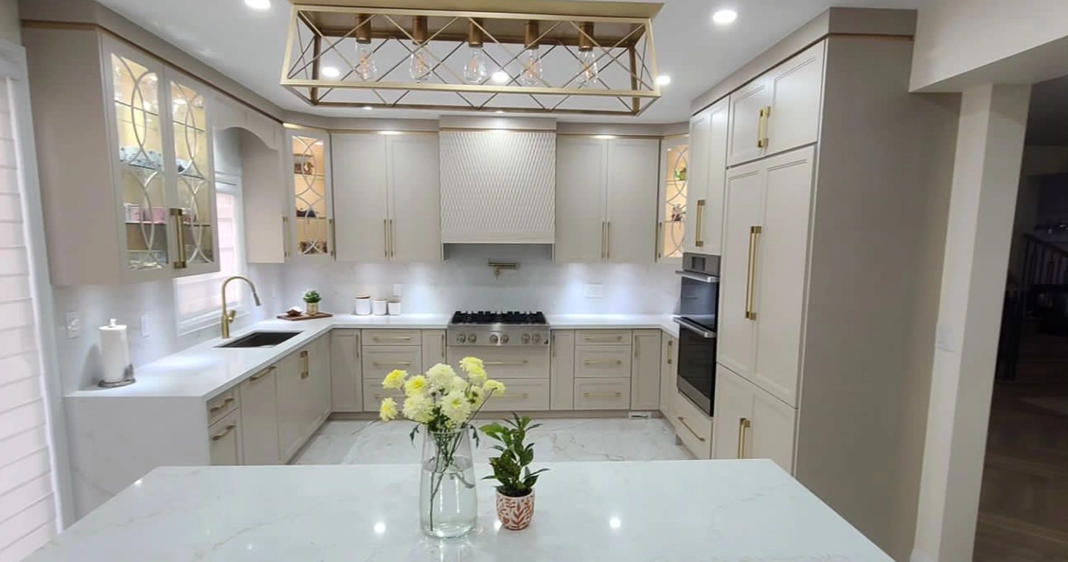 A beige and gold custom kitchen installation completed by Titan Cabinetry
