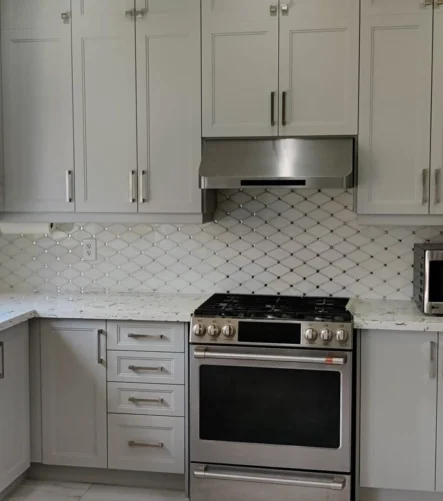 A grey and white kitchen renovation project completed by Titan Cabinetry