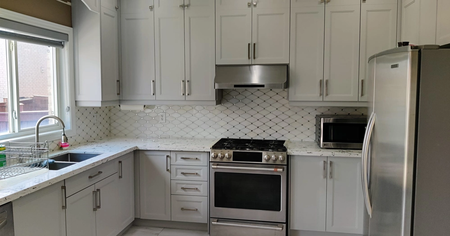A grey and white kitchen renovation project completed by Titan Cabinetry