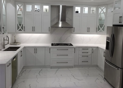 A luxurious gray and white theme kitchen renovation project completed by Titan Cabinetry