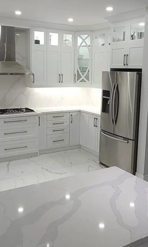 A luxurious gray and white theme kitchen renovation project completed by Titan Cabinetry