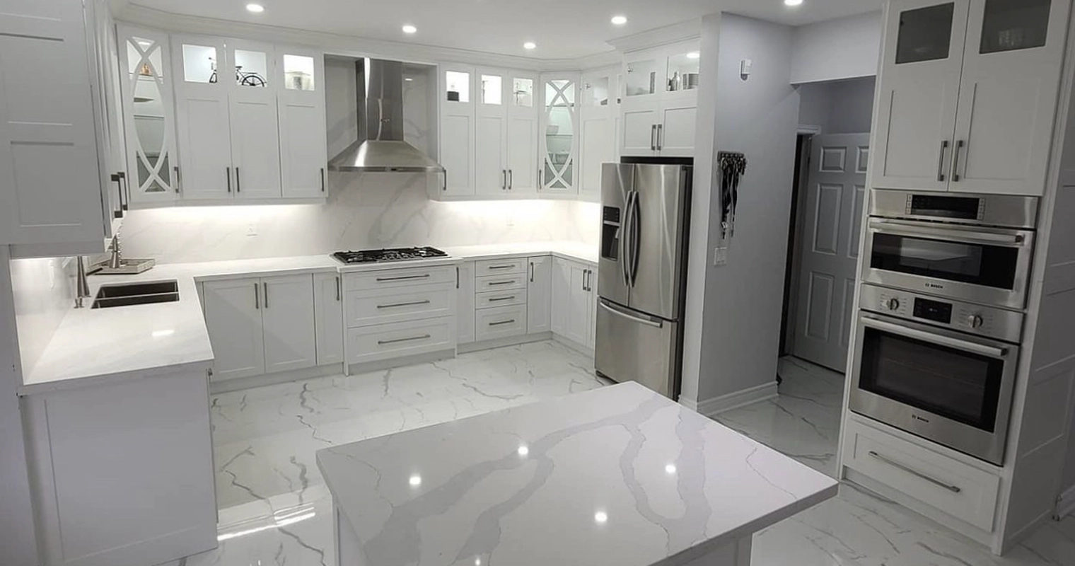 A luxurious gray and white theme kitchen renovation project completed by Titan Cabinetry