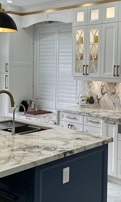 A beautiful white and blue theme kitchen designed and installed by Titan Cabinetry